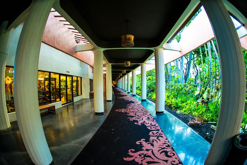 Arched walkway at the Royal Hawaiian Hotel with its pink patterned carpet